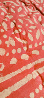 Close-up of a red fabric with light pattern