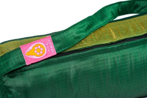 Pink Namaste Amazon yoga mat bag close-up showing deep green sari fabric, gold brocade border, black zip and pink Pink Namaste logo label

